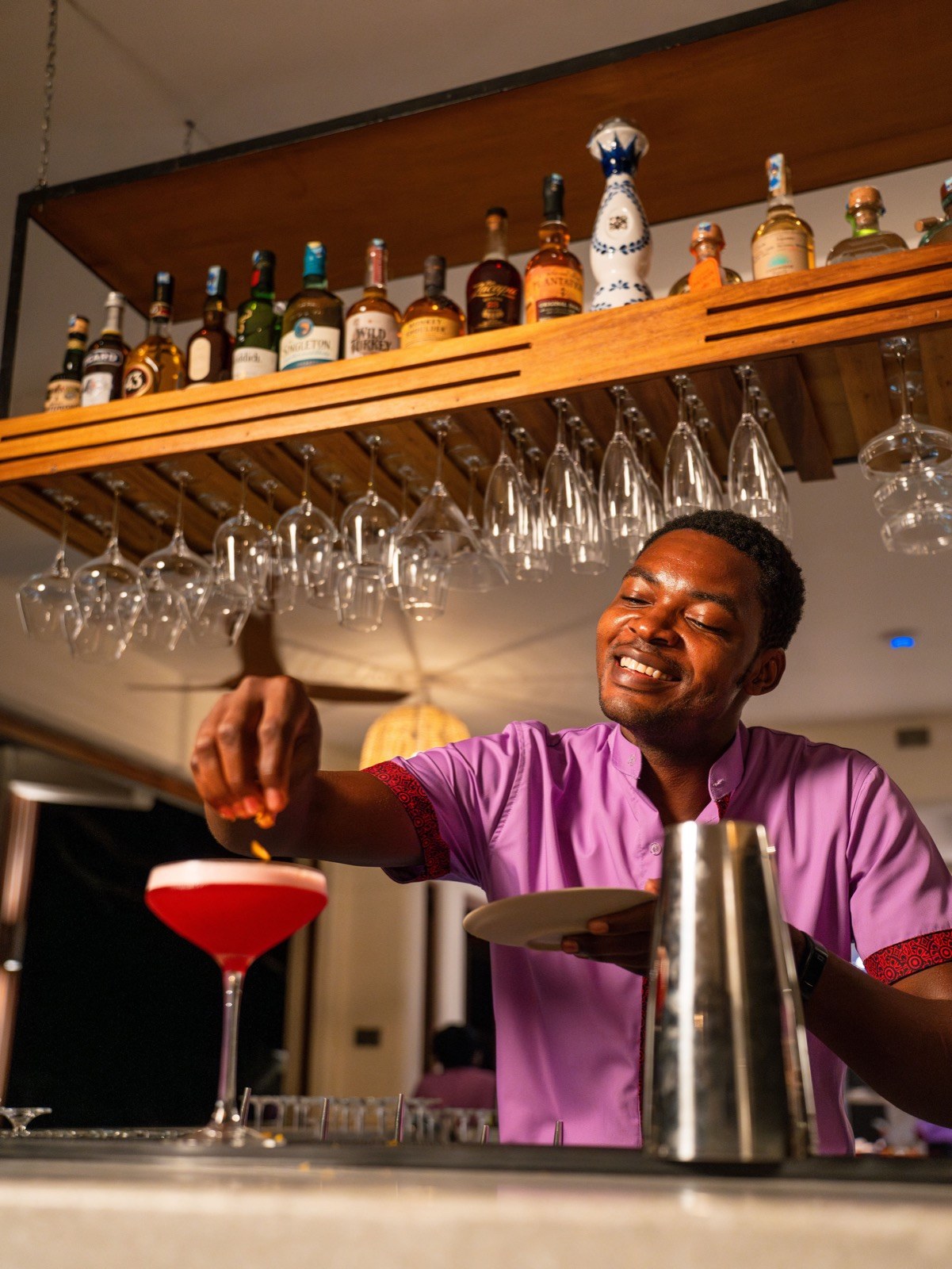 A cocktail being finished at the Tribal Table bar